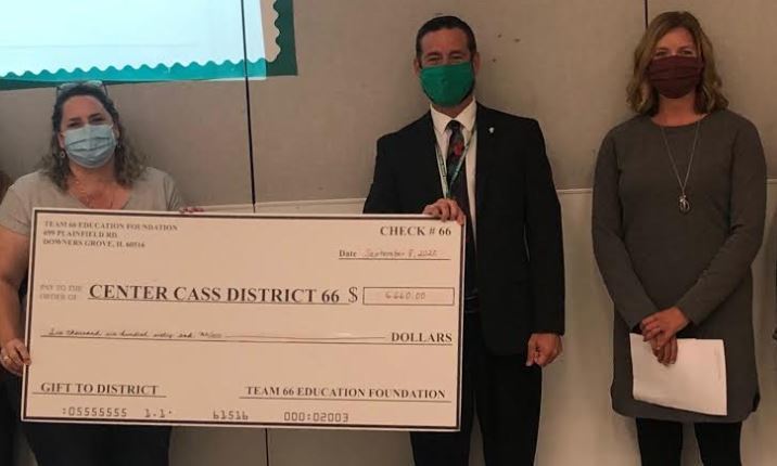 3 people holding a check to Center Cass District 66 for a gift to district from TEAM 66 Education Foundation