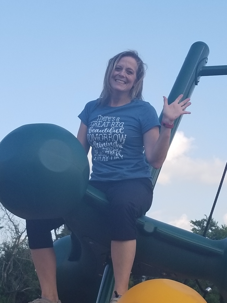 adult smiling on playground