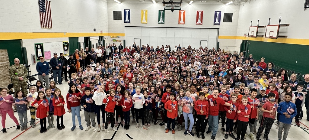 groups of students and veterans with flags