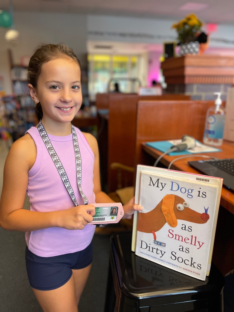 checking out books with library card